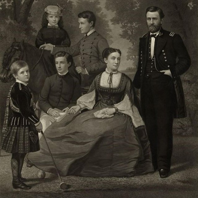 General Ulysses S. Grant in his U.S. Army uniform posing for a photo with his wife and children.
