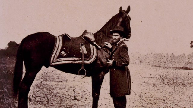Ulysses S. Grant, full-length portrait, facing left, standing alongside his war horse, "Cincinnati