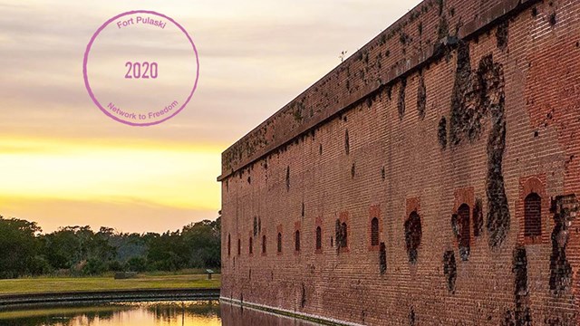 A photograph of Fort Pulaski with a Digital Passport® Stamp in the left hand corner.