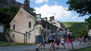 Image of visitors walking in Lower Town of Harpers Ferry National Historical Park.