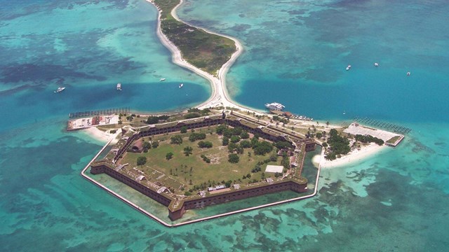 Aerial photograph of a hexagonal shaped fort on an island.
