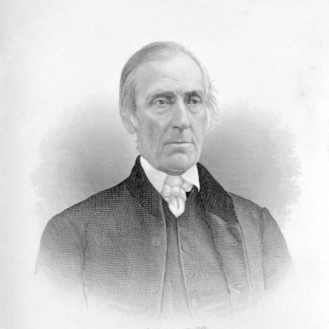 Black and white portrait of a white man.