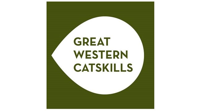 Green background with white teardrop shape with point to the left. Text: "Great Western Catskills"