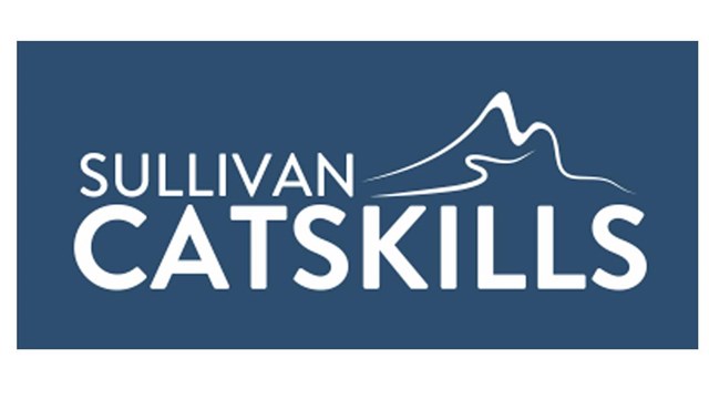 Blue rectangle with white text "Sullivan Catskills." Above "skills" is a white mountain graphic.