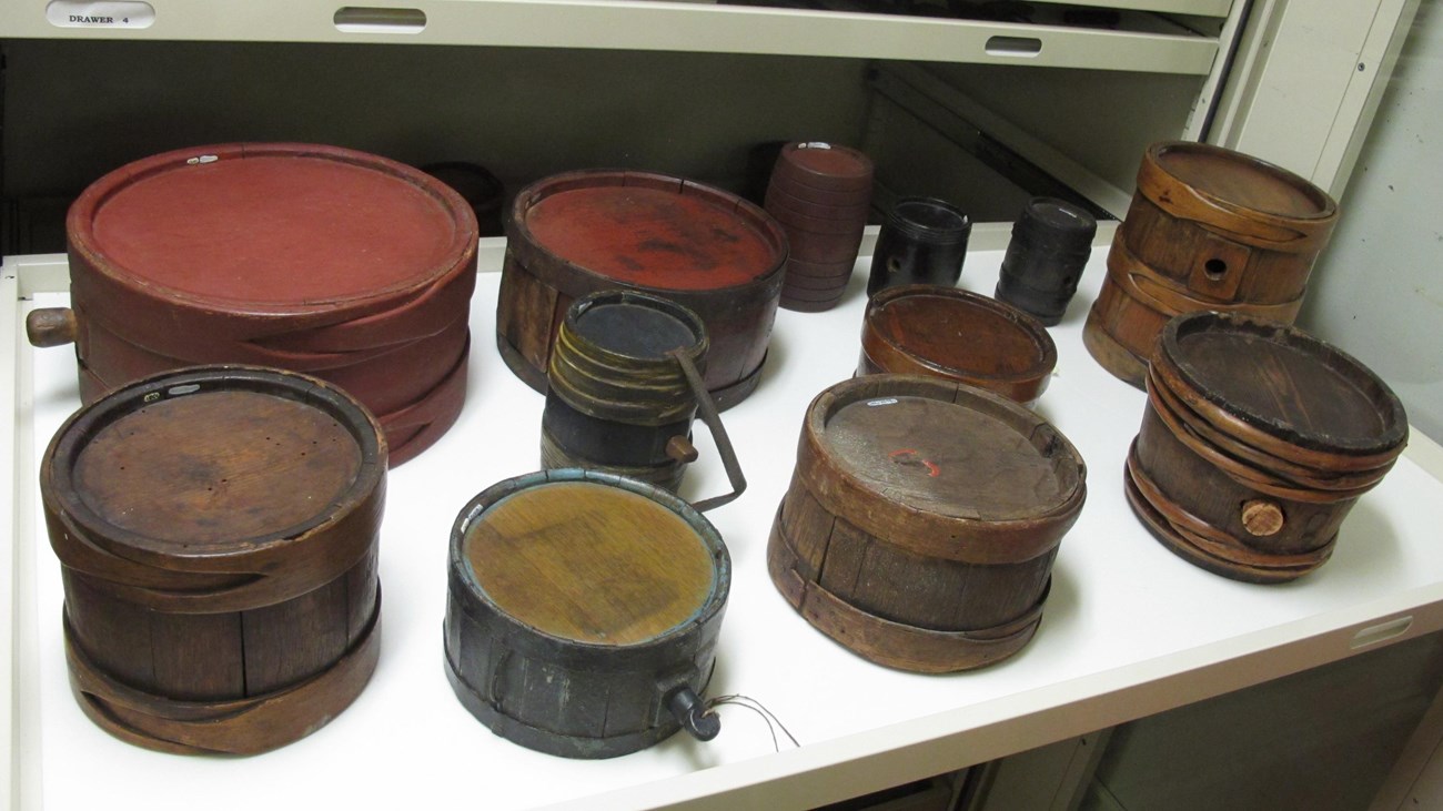 Collection of 18th century wooden drum canteens.