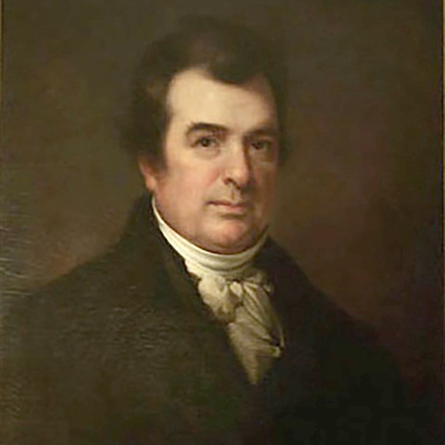 Painted portrait of a man wearing a dark coat and cravate.