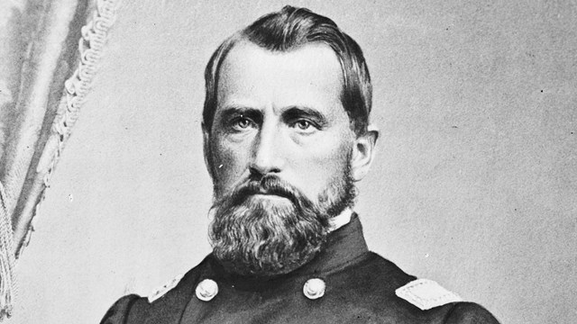 A black and white image of James Tuttle standing in Civil War union generals uniform.