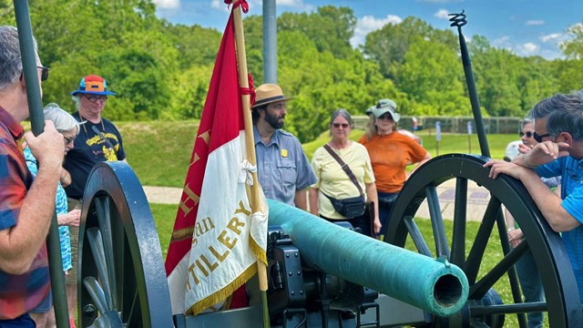 A park ranger speaks to a group of visitors