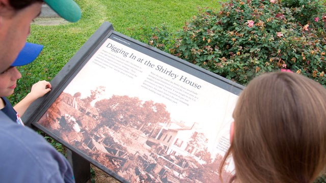 visitors overlooking a sign