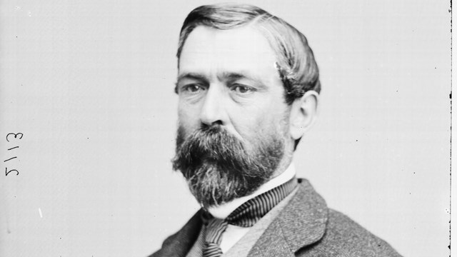 A black and white image of Richard Taylor in civilian smoking jacket.