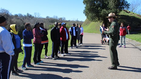Ranger leading a walk in the cemetery