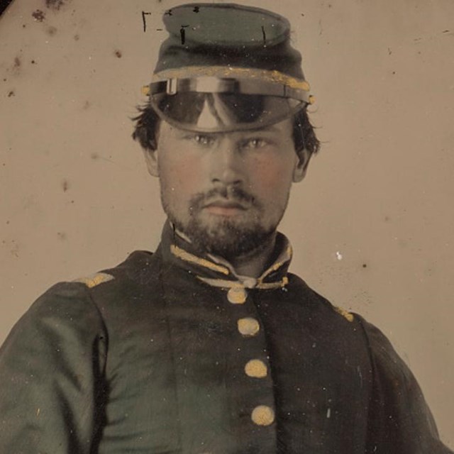 A Confederate officer from Georgia in blue hat and uniform.