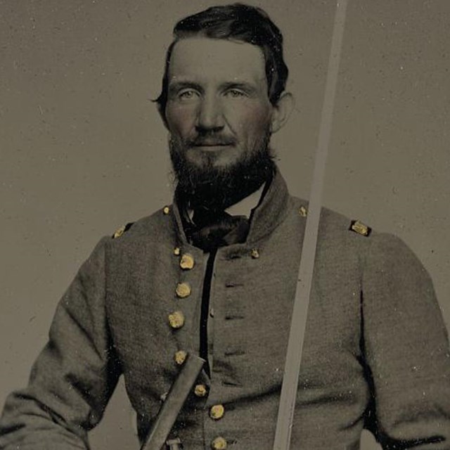 A Confederate officer from Missouri holding his sword.