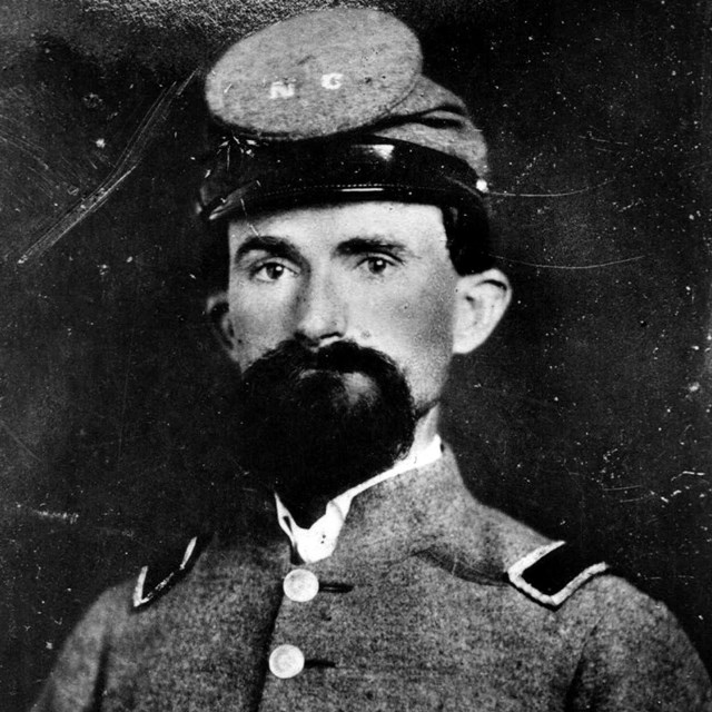 A Confederate officer from North Carolina wearing a gray uniform and cap