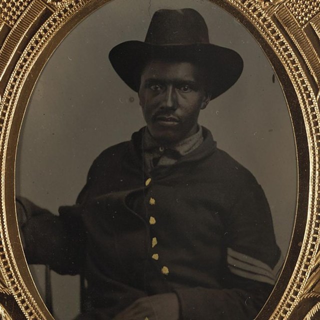 A black Union sergeant wearing a slouch hat.