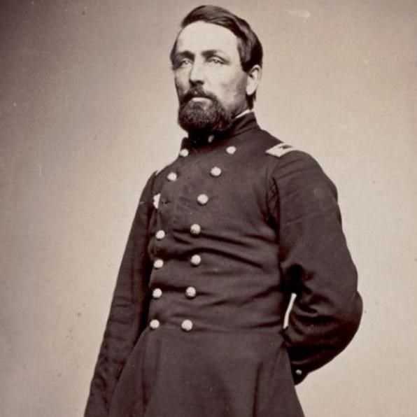 A Union officer standing in uniform with his left arm behind his back.