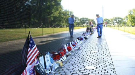 A man walks by the Vietnam Veterans Memorial