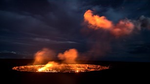 erupting lava glowing at night