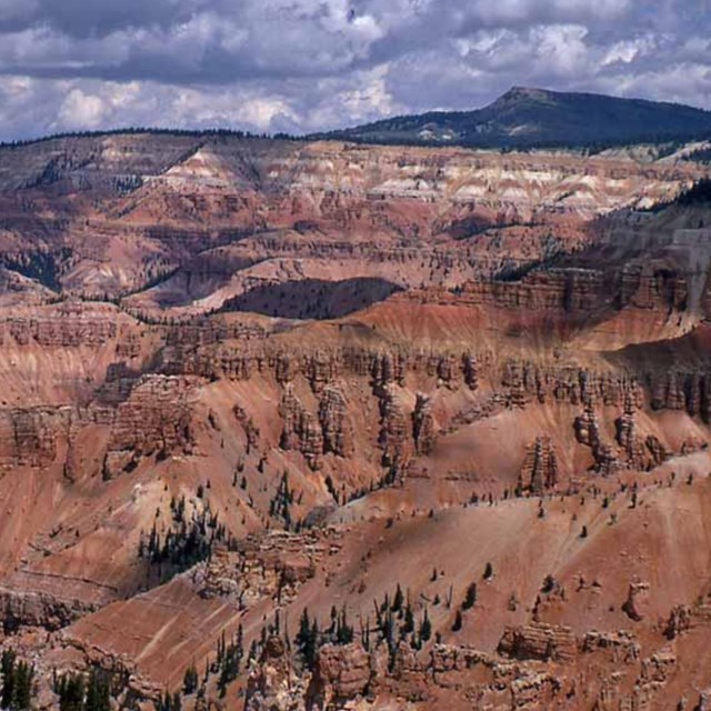 Photo of eroded badlands with spires and hoodoos.