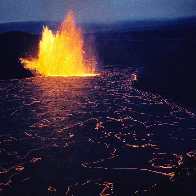 photo of a lava fountain eruption and a lava lake