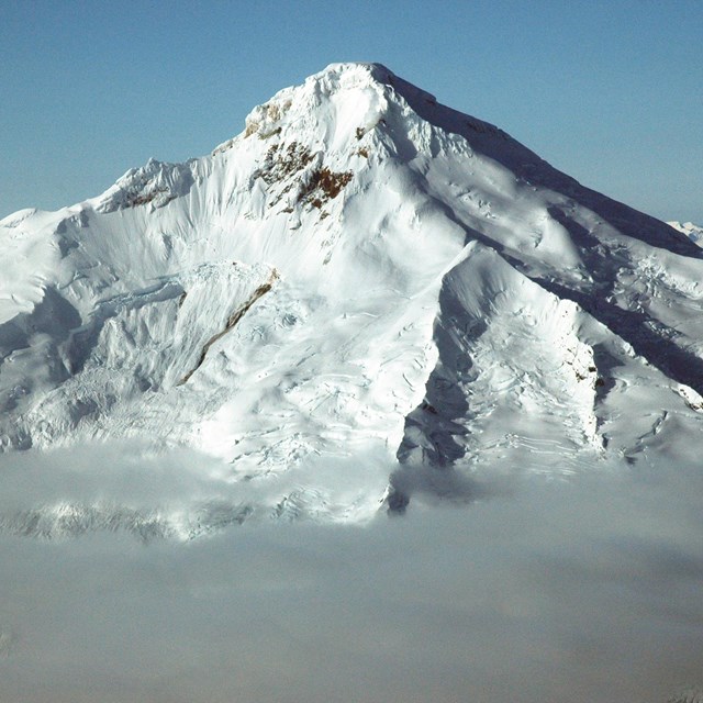 photo of a volcanic peak covered in snow and ice