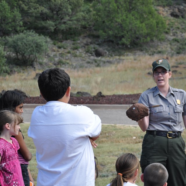 photo of a park ranger holding a 