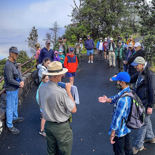 photo of a ranger talking to a group of people