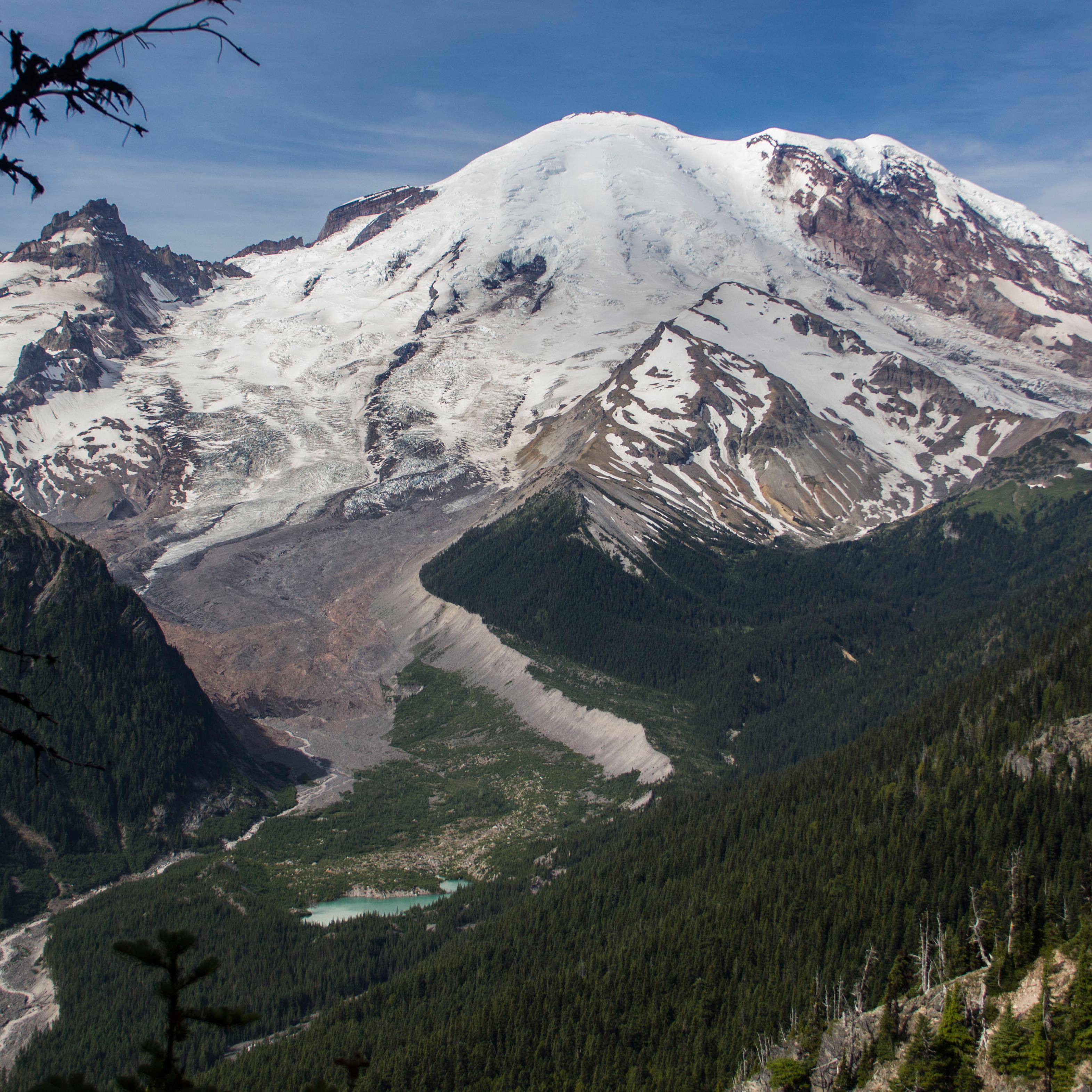 photo of a volcanic mountain with forested slopes