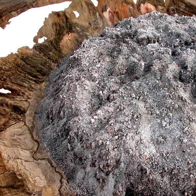 photo of a rounded dome of blocky rock