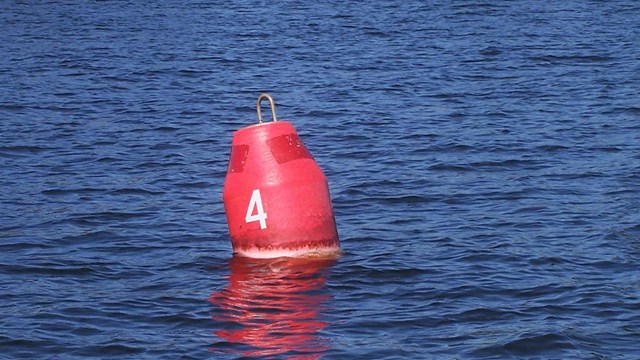 Image of a red buoy in the water