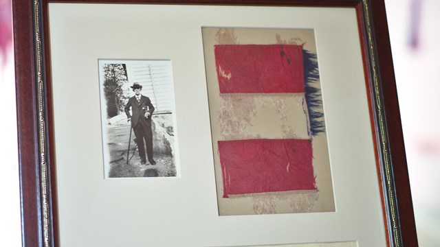 Photo of a fragment of the Seventh Cavalry's guidon flown at the Washita
