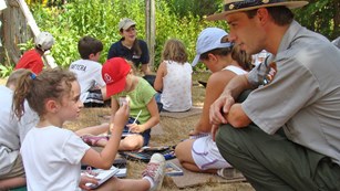 Young girl shares with park ranger