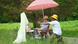 Artist easel and painting of the Weir studio