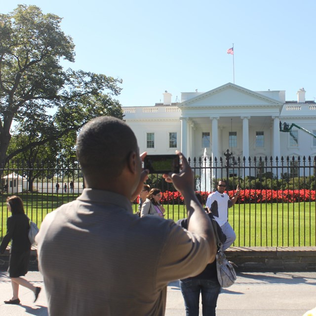 Visitors taking photo of the white house