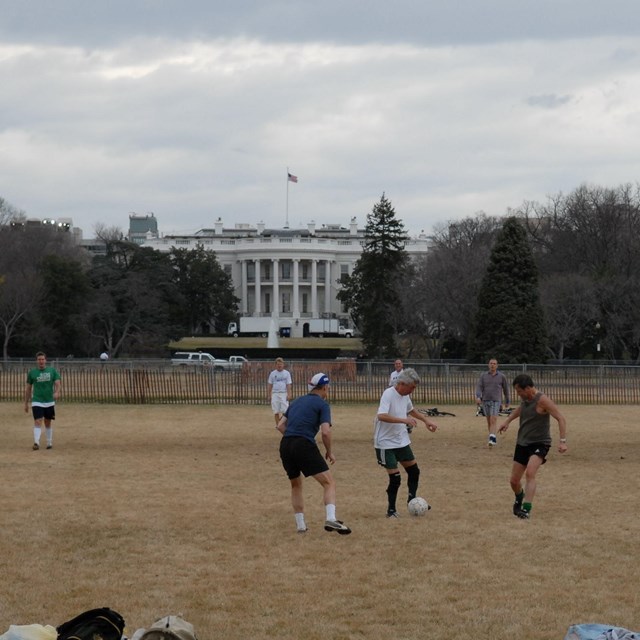 People play soccer on the Ellipse