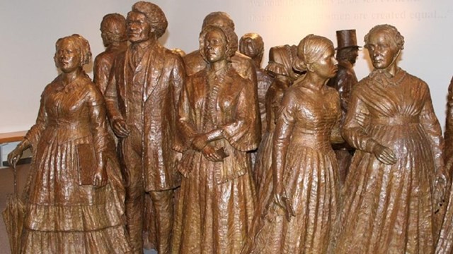 Bronze statues of Frederick Douglass and suffragists. NPS photo