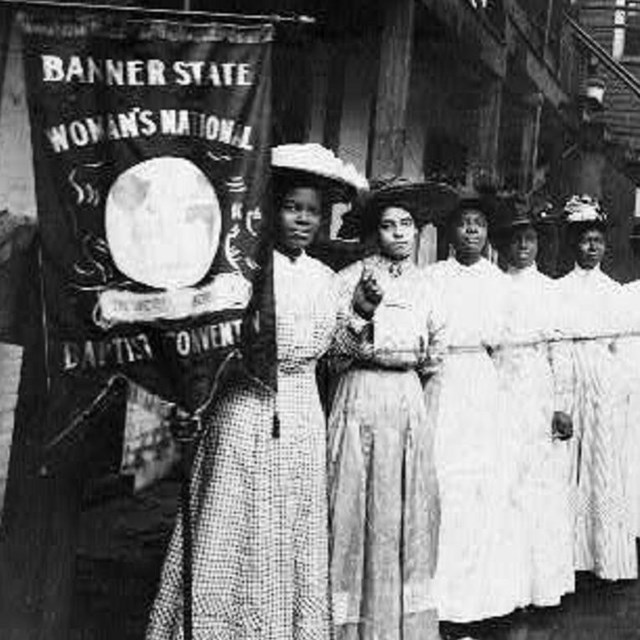 Purple Banner with motto of Oklahoma Federation of Colored Women's Clubs  