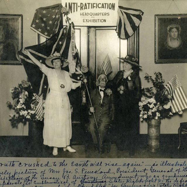 Two women and a man sit outside anti-suffrage headquarters. TN Virtual Archives