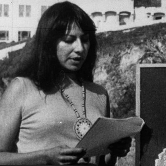 Native American woman presents at protest on Alcatraz Island