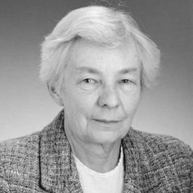 Black and white portrait of a white woman with short gray hair