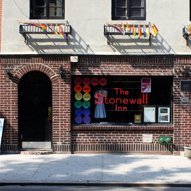 Photo of Stonewall Inn covered in rainbow pride flags. Johannes Jordan, Wikimedia Commons