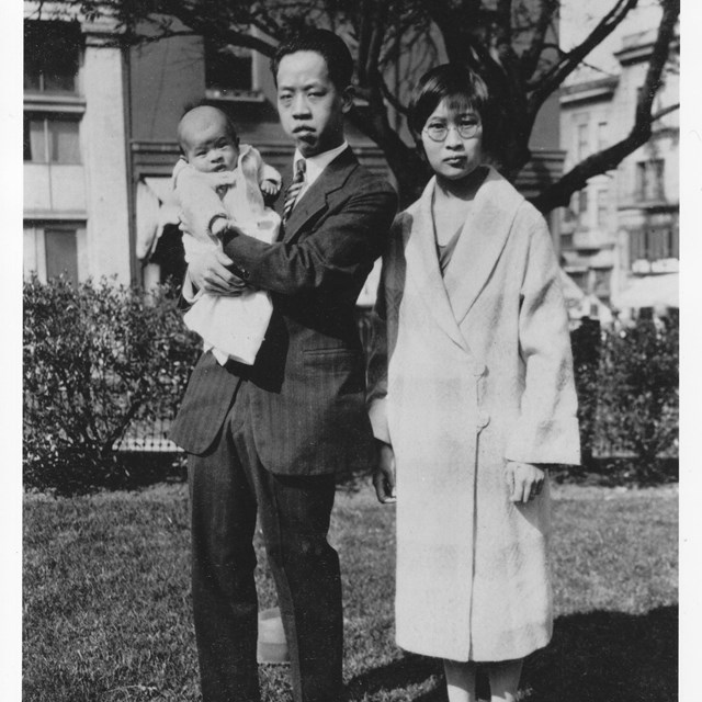 Sue Ko Lee with her husband and child.