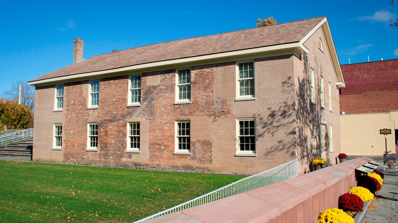 The exterior of the Wesleyan Chapel, with flowers out front.