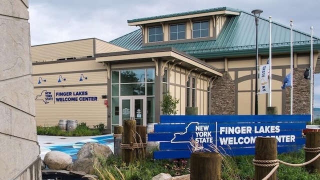 A large building with a sidewalk and nautical design