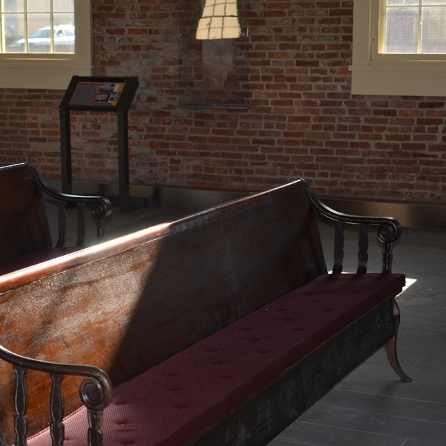 Light hits the empty pews in the Wesleyan Chapel