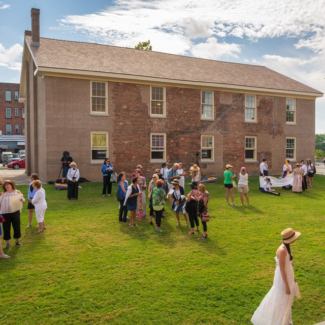 A view of the Wesleyan Chapel with a crowd outside.