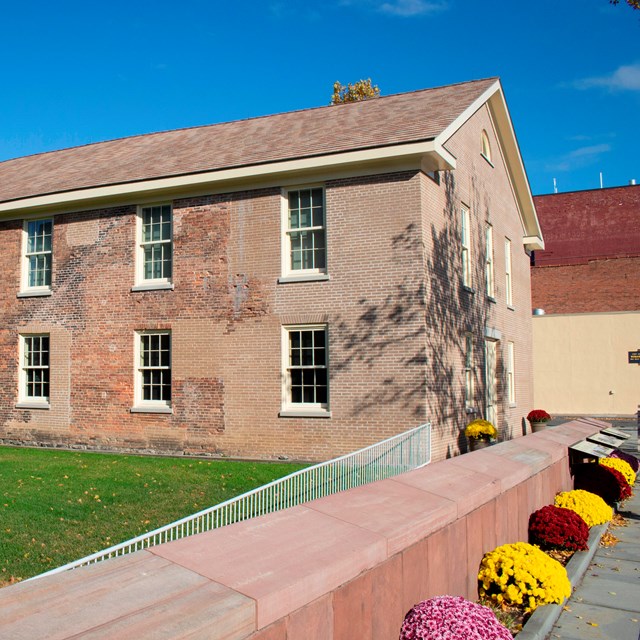 The exterior of the Wesleyan Chapel, with flowers out front.