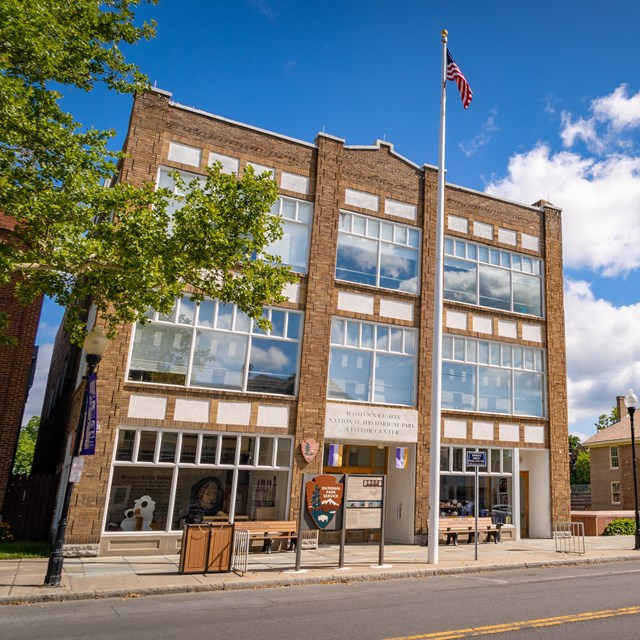 A wide-angle image showing the Visitor Center and Wesleyan Chapel from across the street.