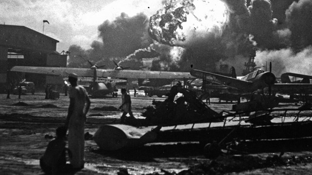 B&W photo of exploding ships