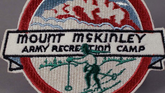 A patch showing skier with words 'Mount McKinley Army Recreation Camp'